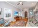 Inviting living room with hardwood floors, comfortable seating, and an entertainment center with a TV at 802 Robert E. Lee Blvd, Charleston, SC 29412