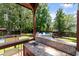Outdoor kitchen on a well-maintained deck features a sink, hot tub, and inground pool for backyard enjoyment at 8320 Tyrian Path, North Charleston, SC 29418