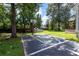 An expansive backyard with a basketball court, in-ground pool, and storage shed offers fun and relaxation at 8320 Tyrian Path, North Charleston, SC 29418