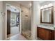 Bright bathroom features a walk in shower, large vanity and natural light at 8320 Tyrian Path, North Charleston, SC 29418