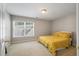 Bright bedroom with a cozy bed and a large window at 8320 Tyrian Path, North Charleston, SC 29418