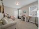 Cozy bedroom featuring natural light, carpet flooring, desk, and neutral-colored walls at 8320 Tyrian Path, North Charleston, SC 29418