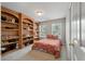 Cozy bedroom with a bed, storage and windows letting in natural light at 8320 Tyrian Path, North Charleston, SC 29418