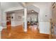 Inviting entryway with hardwood floors, flowing into the living room, kitchen, and dining area at 8320 Tyrian Path, North Charleston, SC 29418