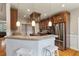 Bright kitchen featuring granite countertops, stainless steel appliances, and dark wood cabinetry at 8320 Tyrian Path, North Charleston, SC 29418