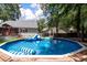 Refreshing above-ground pool with a slide, hot tub, and plenty of space for outdoor fun at 8320 Tyrian Path, North Charleston, SC 29418