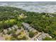 Beautiful aerial view of a neighborhood nestled amongst lush green trees, ponds and marshlands at 907 High Nest Ln, Charleston, SC 29412
