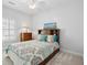 Neutral bedroom showcasing a bed with storage drawers, a wood headboard and matching dresser at 907 High Nest Ln, Charleston, SC 29412