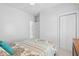 Clean, airy bedroom features white walls, carpet and trim with a ceiling fan for added comfort at 907 High Nest Ln, Charleston, SC 29412