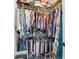 Walk-in closet with metal racks is fully stocked with hanging clothes and personal items at 907 High Nest Ln, Charleston, SC 29412