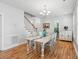 Dining room with a large table, staircase access, and natural light from the adjacent windows at 907 High Nest Ln, Charleston, SC 29412