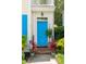Bright blue front door of home with brick steps, potted plants, and the house number 907 at 907 High Nest Ln, Charleston, SC 29412