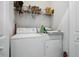 Laundry room includes white washer and dryer units with open shelving and an extinguisher at 907 High Nest Ln, Charleston, SC 29412