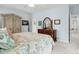Comfortable bedroom featuring a four-poster bed, warm lighting, and ample storage space with decorative furniture at 907 High Nest Ln, Charleston, SC 29412