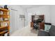 Well-lit room showcases an office space featuring a dark wood desk, light blue walls and gray carpeting at 907 High Nest Ln, Charleston, SC 29412