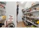 Organized pantry with shelving units filled with various food items, enhancing kitchen storage and convenience at 907 High Nest Ln, Charleston, SC 29412