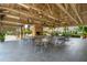Spacious pavilion features an outdoor brick fireplace, ceiling fans, and ample seating at 907 High Nest Ln, Charleston, SC 29412