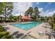 Community pool with inviting turquoise water, surrounded by lounge chairs and shaded pergola at 907 High Nest Ln, Charleston, SC 29412