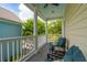 Relaxing covered porch with comfortable outdoor seating and serene views of the surrounding landscape at 907 High Nest Ln, Charleston, SC 29412