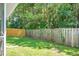 Well-manicured backyard featuring a wooden fence, lush green grass, and plenty of privacy at 9255 Ayscough Rd, Summerville, SC 29485