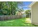 A large, well-maintained backyard with a lush lawn and privacy fence, perfect for outdoor activities at 9255 Ayscough Rd, Summerville, SC 29485
