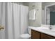Cozy bathroom with a shower-tub combination, white vanity, and decorative accents at 9255 Ayscough Rd, Summerville, SC 29485