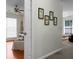 Bedroom hallway showcasing interior design, artwork, and glimpses of connected living spaces at 9255 Ayscough Rd, Summerville, SC 29485