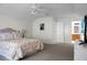 Bright bedroom with carpeting, a comfy bed, and an en-suite bathroom at 9255 Ayscough Rd, Summerville, SC 29485