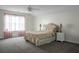 Spacious bedroom featuring plush carpeting, vaulted ceilings, and a floral-patterned bed set at 9255 Ayscough Rd, Summerville, SC 29485