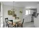 Bright eat-in kitchen boasts white cabinets and stainless steel appliances creating a clean and modern space at 9255 Ayscough Rd, Summerville, SC 29485