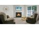 Cozy living room features a fireplace, neutral paint, and new carpet; ideal for relaxing and entertaining at 9255 Ayscough Rd, Summerville, SC 29485