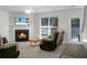 Cozy living room with fireplace, TV, neutral walls, carpet and furniture at 9255 Ayscough Rd, Summerville, SC 29485