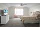 Spacious bedroom with a large window, neutral walls, and a ceiling fan for added comfort at 9255 Ayscough Rd, Summerville, SC 29485