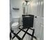 Updated bathroom with black and white tile, farmhouse vanity and a toilet at 963 Yorktown Dr, Charleston, SC 29412
