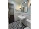 Charming bathroom featuring a pedestal sink, eye-catching floor tiles, and elegant fixtures at 963 Yorktown Dr, Charleston, SC 29412