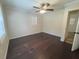 A spacious empty bedroom with wood flooring, neutral colored walls, and a ceiling fan at 963 Yorktown Dr, Charleston, SC 29412