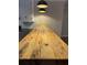 Rustic wooden countertop with dark pendant lighting, offering a unique kitchen design element at 963 Yorktown Dr, Charleston, SC 29412