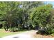 Exterior view of home with trees, palm trees and neat landscaping at 963 Yorktown Dr, Charleston, SC 29412
