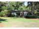 Well-maintained home with green lawn, lush bushes and an American flag displayed at 963 Yorktown Dr, Charleston, SC 29412