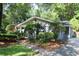 Charming single-story home with beautiful landscaping, a sidewalk, and an American flag proudly displayed at 963 Yorktown Dr, Charleston, SC 29412