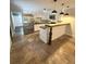 Updated kitchen featuring white cabinets, stainless steel appliances, and breakfast bar at 963 Yorktown Dr, Charleston, SC 29412