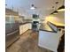 Bright and airy kitchen with stainless steel appliances, stylish lighting, and breakfast bar at 963 Yorktown Dr, Charleston, SC 29412