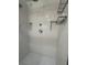 A new white tiled shower with built in shelves and dual shower heads at 963 Yorktown Dr, Charleston, SC 29412