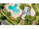 The community pool features lounge chairs, a clubhouse, and lush greenery perfect for enjoying a sunny day at 9710 Table Mountain Ln, Ladson, SC 29456