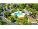 The community pool and clubhouse are surrounded by lush greenery and beautiful neighborhood homes nearby at 9710 Table Mountain Ln, Ladson, SC 29456