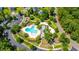 An aerial view shows the community pool, clubhouse, playground, and parking lot surrounded by neighborhood homes at 9710 Table Mountain Ln, Ladson, SC 29456