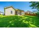 Spacious backyard featuring lush green grass and mature trees at 9710 Table Mountain Ln, Ladson, SC 29456