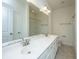 Bathroom with a double sink vanity and large mirror and combination shower/tub at 9710 Table Mountain Ln, Ladson, SC 29456