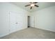 Bedroom featuring neutral carpeting, a ceiling fan, and a double door closet at 9710 Table Mountain Ln, Ladson, SC 29456