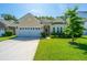 Charming single-Gathering home featuring a two-car garage, well-maintained lawn, and inviting curb appeal at 9710 Table Mountain Ln, Ladson, SC 29456